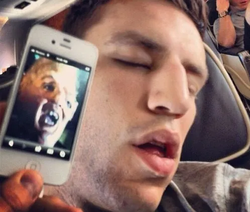 Milan Lucic asleep on the plane looking like Sloth from the Goonies.